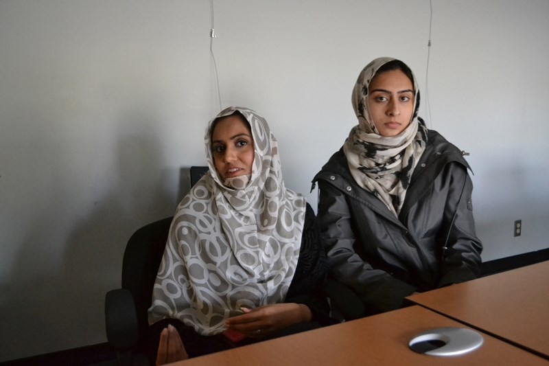 Nabila Malik, left, and Shaistah Ahmad, who visited the Olds Municipal Library, are confident a new law in Quebec restricting face coverings won&#8217;t be replicated in this 