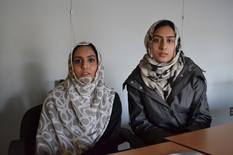 Nabila Malik, left, and Shaistah Ahmad were among members of the Ahmadiyya Muslim community of Calgary who maintained an exhibition in the Olds library explaining Islam from