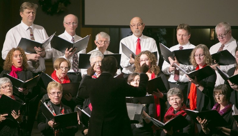 Members of the Olds Community Chorus perform under the direction of Ross Dabrusin during a Christmas Concert at the Olds First Baptist Church.