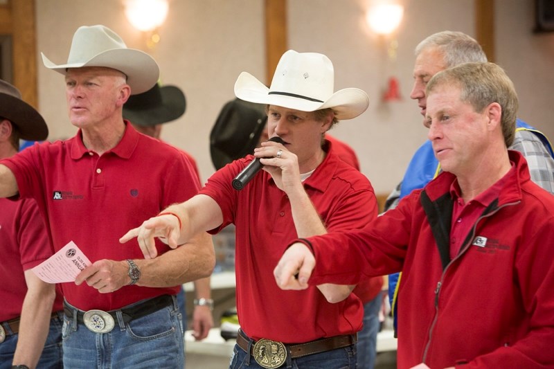 Members of Rosehill Auction Services auction off items during the Kiwanis Fall Auction at the Olds Legion on Dec. 7. All told, the auction and other donations set a record,