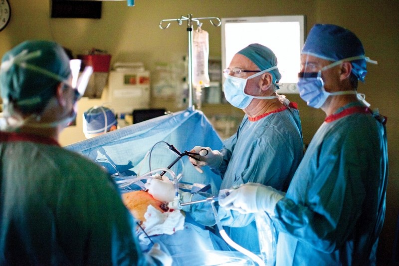 Dr. Sinclair Cox, second from right, performs laproscopic gallbladder surgery at Olds Hospital on Dec. 22.