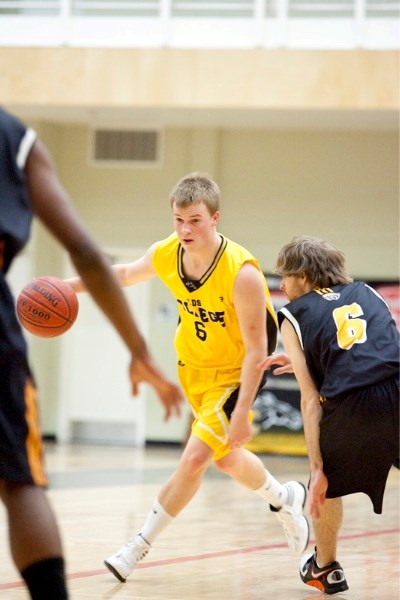 Olds College Broncos senior boys player Sam Kirkness in action against Prairie Bible Institute at the CLC last Wednesday.