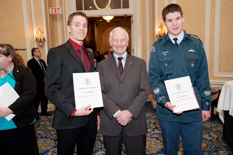 Ben Peachment (left) and Jesse Peachment (right) receive awards from Gov.-Gen. David Johnston.