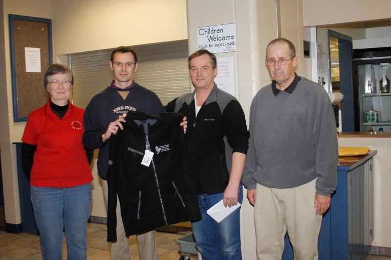 Darren Brown (second from left) was recently recognized as the area&#8217;s nominee for the Canadian Curling Association&#8217;s volunteer of the year award. He is flanked by 