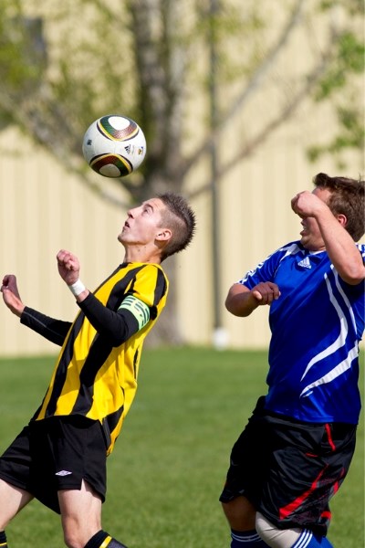 Olds High School Spartans player Chase Grenier heads the ball during the Spartans game against the Innisfail Cyclones at Olds High School last Thursday. The Spartans won the