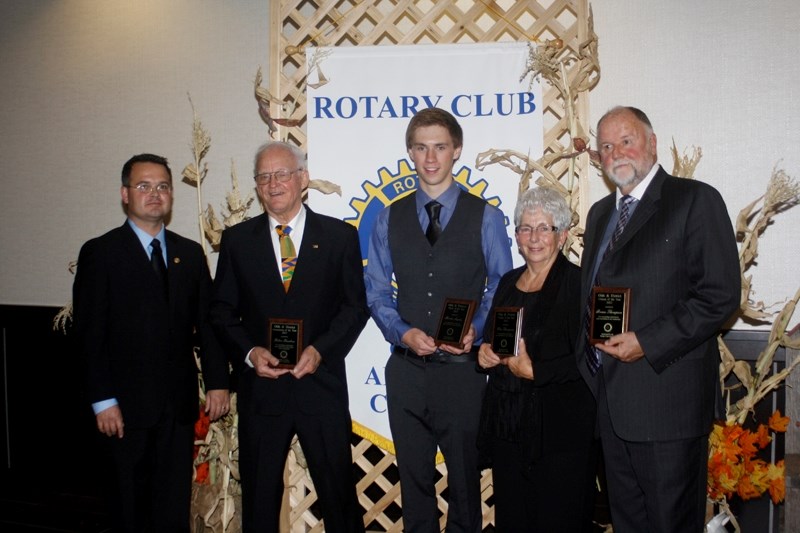 Several citizens of the year were named on Saturday at the annual Rotary Harvest Ball. Mitch Thompson, president of the Rotary Club, presented Robin Knudsen with the