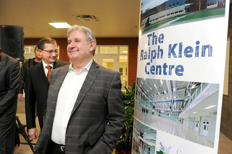 Alberta&#8217;s former premier Ralph Klein smiles after the unveiling of a sign naming part of the Community Learning Campus the Ralph Klein Centre in 2010.