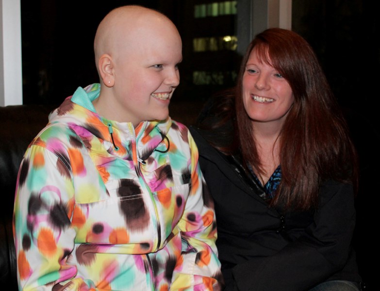 Mckenzie Robbie, 15, enjoys a laugh with her mother, Staci, during a fundraiser in her honour on April 12 at the Olds College Alumni Centre. The event raised roughly $10,000