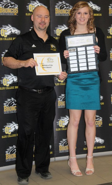 Basketball player Kylie Lebedeff was named the college&#8217;s female athlete of the year in the Alberta Colleges Athletic League category. Here, she is pictured with Greg