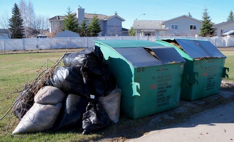 The Town of Olds points out these bins meant for grass clippins, leaves and garden waste near the intersection of 63 and 65 avenues as an example where people are misusing