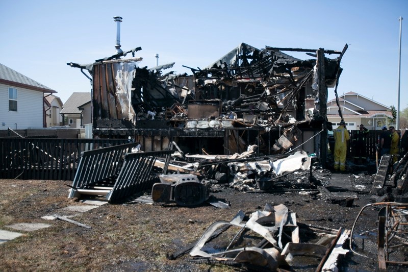 Investigators were combing through the ruins of a home on Hawthorn Way that was destroyed in a fire on the night of May 8 looking for clues to the cause of the blaze. Six