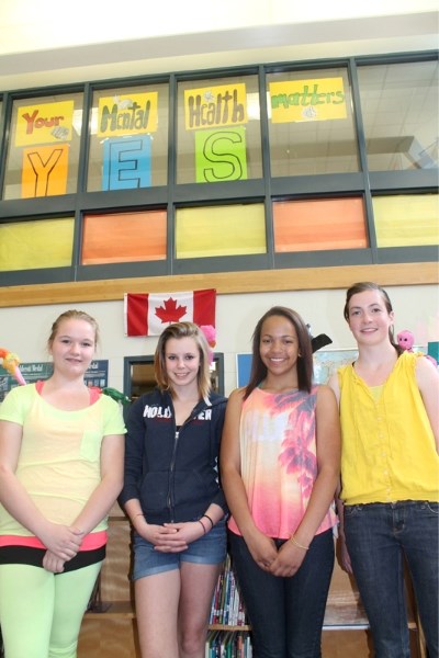 Grade 8 students (from left) Courtney Poland, Shay Walls, Sydney Allen and Laura Klinck, all members of Ecole Deer Meadow School&#8217;s Interact Club, stand in front of a