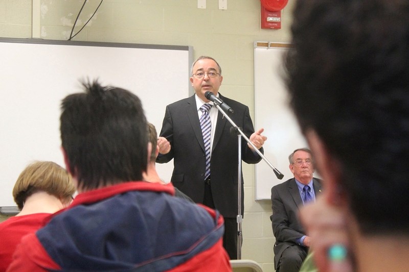 Frank Oberle, Alberta&#8217;s associate minister of services for persons with disabilities, hosts a discussion in Olds on May 22 about how $42 million in budget cuts will