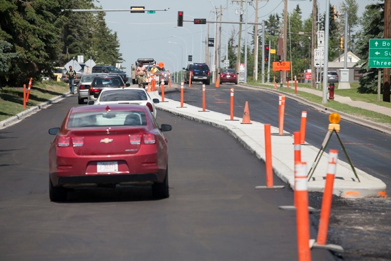 Local construction companies are concered that the new centre divider along Highway 2A south of its intersection with Highway 27 makes the roadway too narrow for large trucks 