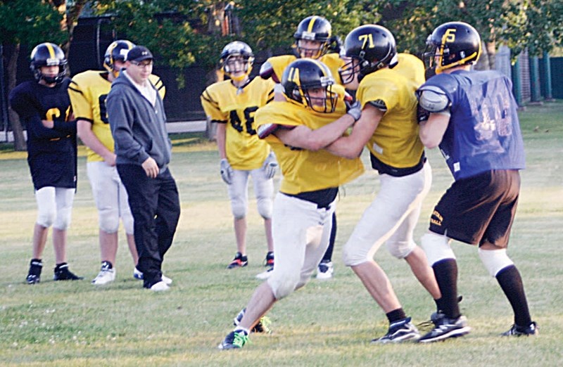 Olds High School football players were practising their blocking skills on Aug. 23 in preparation for the Spartans&#8217; first action of the year: a controlled scrimmage in