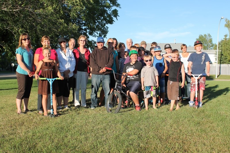 Members of the Bowden Community Action Plan committee, pictured here at the green space off of 22 Avenue in Bowden where they want to build a new park, have received word