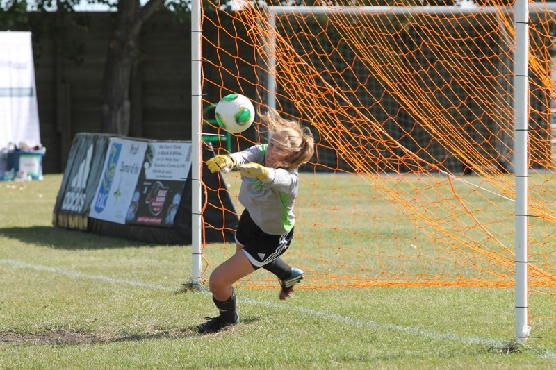 Vanessa Lea, goalkeeper for the Olds College Broncos women&#8217;s soccer team, makes a diving save against a penalty kick during the dying seconds of the first half in a