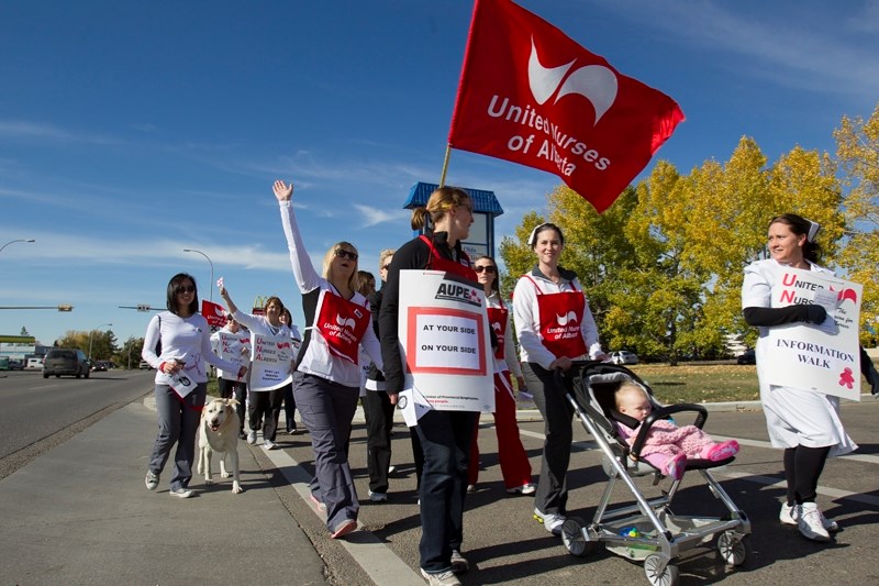 A group of nurses from the region walk down Highway 27 in an effort to raise awareness of concerns the nurses have over staffing levels on Oct. 4.