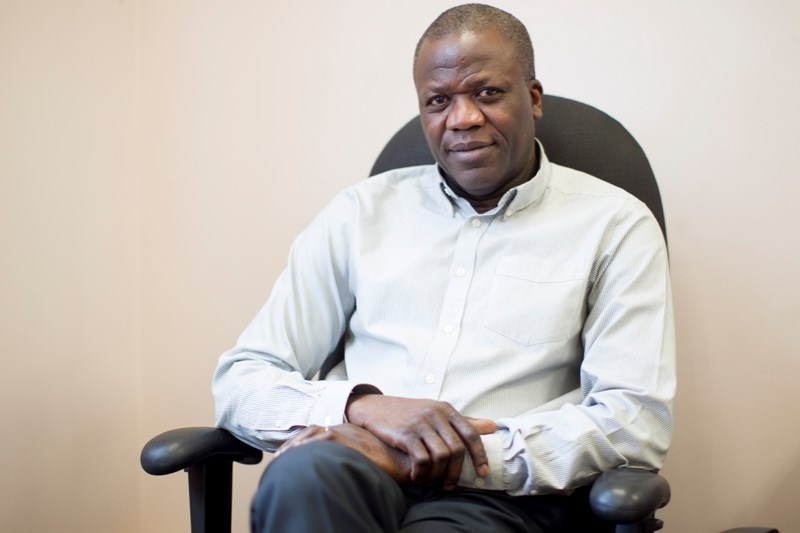 Dr. Abimbola Abiola sits in his office at Olds College on Nov. 8. Abiola will be taking a position with the Inter-American Institute for Cooperation on Agriculture in