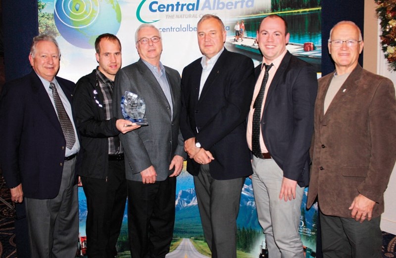 Members of Olds Fibre Ltd. accepted the Central Alberta Economic Partnership&#8217;s Business of the Year award that was bestowed to O-NET on Nov. 27. Bill Dunbar, interim