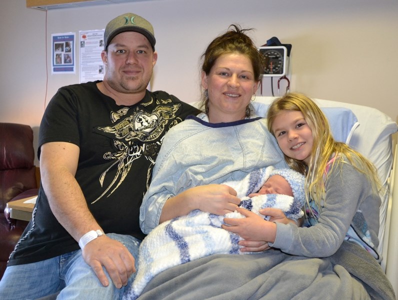 From left are Yvon Caron, Margaret Erickson, New Year&#8217;s Baby Lucas Yvon Caron-Erickson, and one of his sisters, Thea Alcock. Missing: Lucas&#8217;s other sister, Seline 