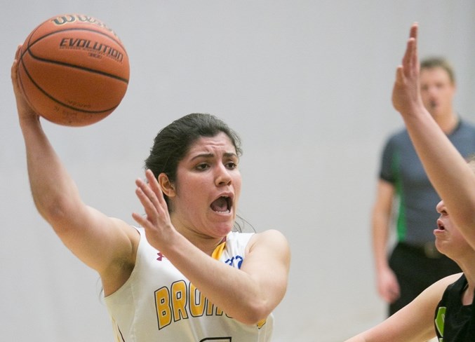 Olds College Broncos basketball player Michaela Allen-Gullion looks for a pass during the Broncos&#8217; game against the Red Deer College Queens at the Ralph Klein Centre on 