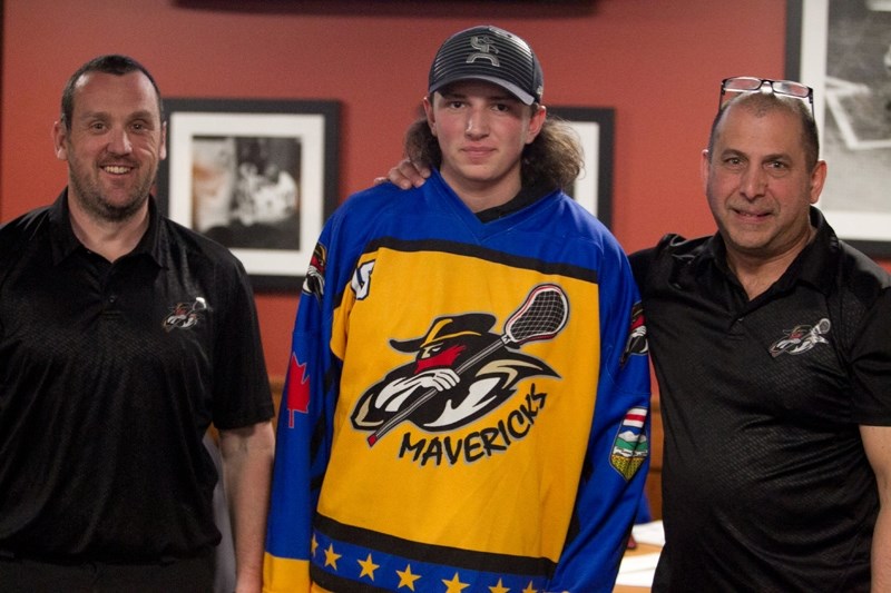 Co-managers of the Olds Stingers and Mavericks lacrosse teams Andy Sweetman, left, and Gary Gaudette, far right, pose with Marshall Bloomfield after he was picked first in