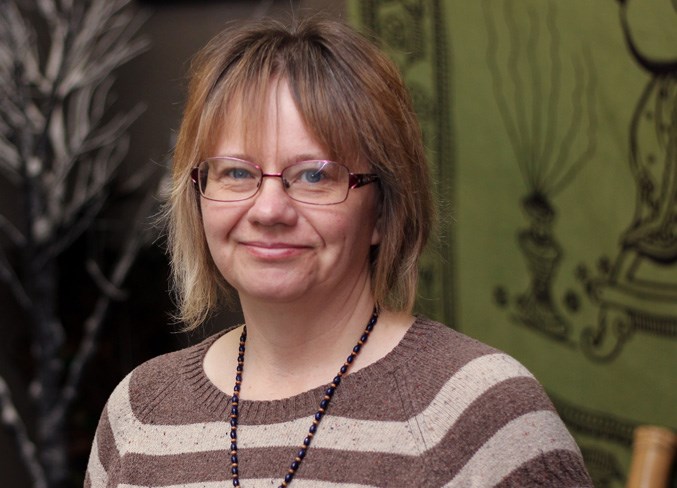 Bladder cancer patient Bonnie Supernant stands in her store.