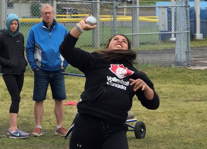 Local athlete Haylin Eling throws the shot put.