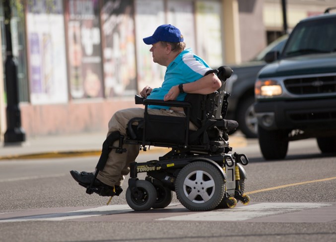 Dean Craig crosses the intersection at 50th Avenue and 51st Street in Olds.