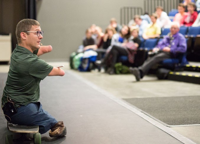 Motivational speaker Chris Koch speaks to students at the TransCanada Theatre.