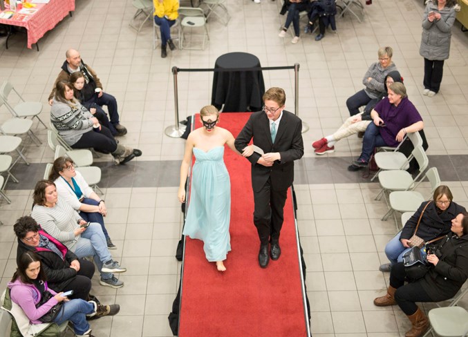 Students walk the runway during the Gowns4Grads&amp;Tuxes2 show at the OHS commons.