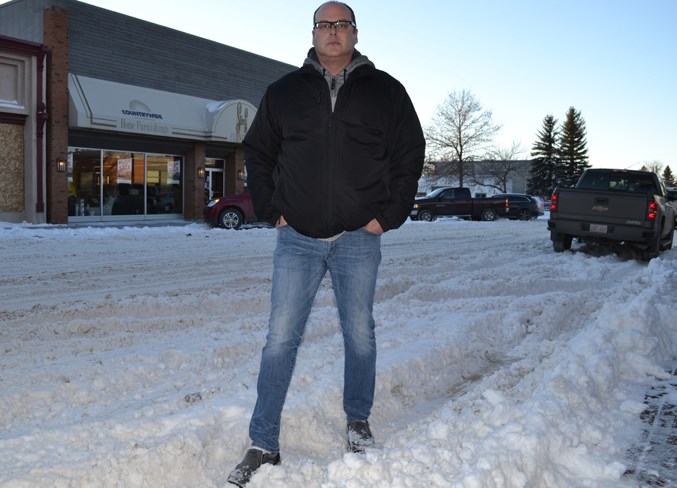 Drew Marceton stands on a snowy 51st Street in Uptowne.