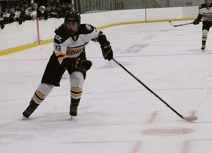 Olds College Broncos forward Abby Webster races down the ice.