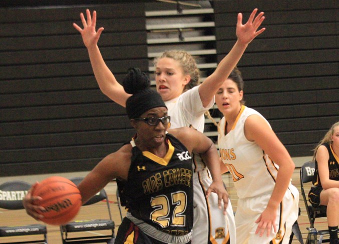 Olds College Bronco Brittney Thibeaux takes the ball down the court.