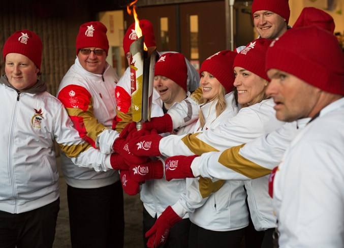 The torchbearers pose for a photo at the conclusion of the relay.