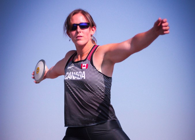 Rachel Andres gets ready to hurl a discus.