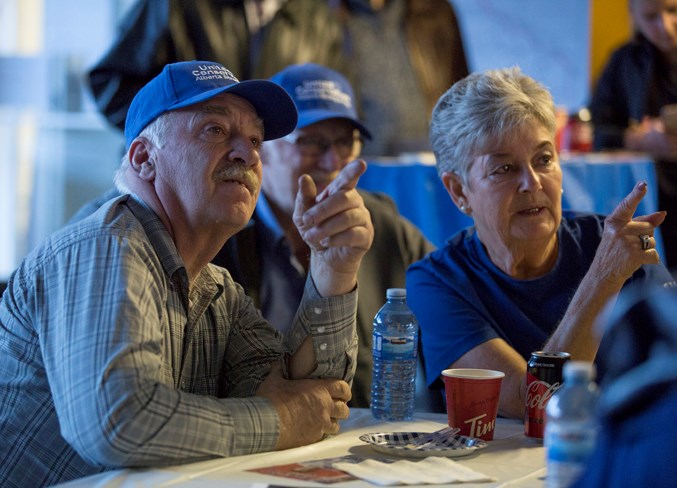  Lawrence Trenholm, left, and Penny Coyne watch as results come in at MLA Nathan Cooper's campaign headquarters on April 16. Noel West/MVP Staff