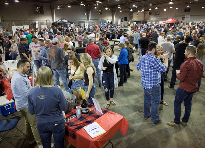 Attendees pack the Cow Palace during the event.