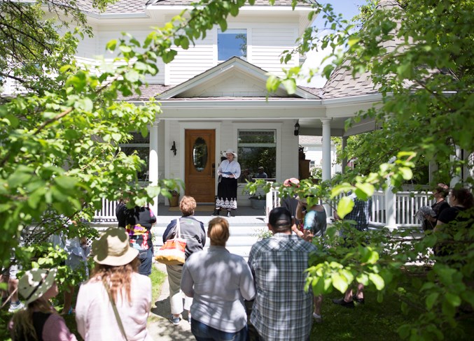  Cheri Woodruff gives a presentation at one of the Craig houses during a walking tour of historical places in Olds.