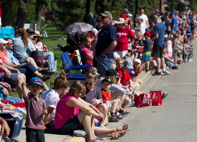 People line 50 Avenue for the Canada Day parade in Olds on July 1.