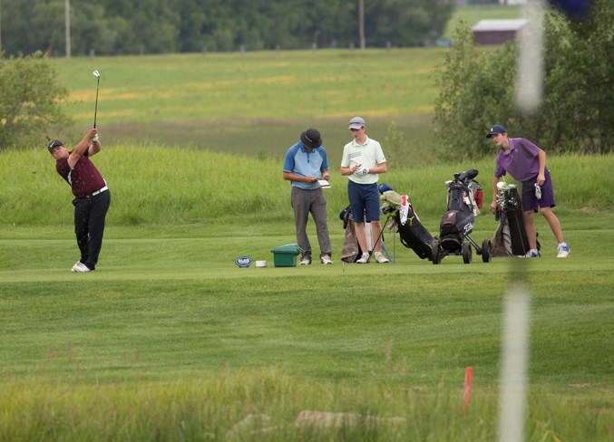 Jarrett Bossert hits a tee shot during the event.