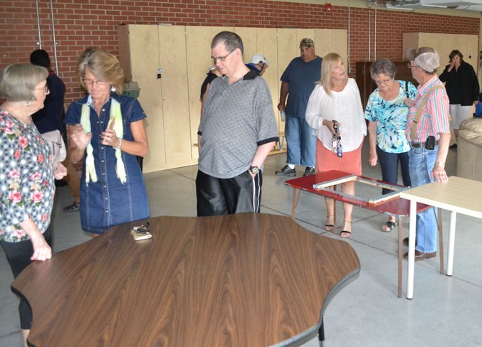 Attendees tour the school&#8217;s former greenhouse.