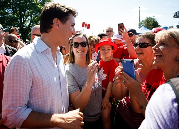 Prime Minister Justin Trudeau visits with fans during Canada Day celebrations.