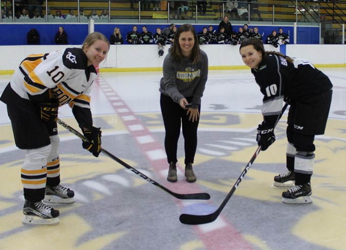 WebKrista Wilson dropped ceremonial puck drop with Broncos captain Kali Cummings. Photo by Abbey Iverson