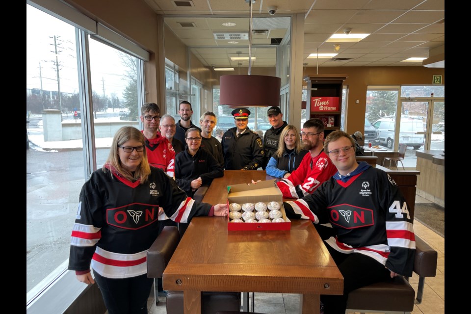 Special Olympics athletes Neal and Natalie Seqouine, Eric Froese, and Ian McKie were joined by local Tim Hortons owners Colton Thornton, Chris Alexander, Dan Wall, Carmen Wall, and Cherylin Wall, as well as York Regional Police Chief Jim MacSween and Const. Kevin Selwood.