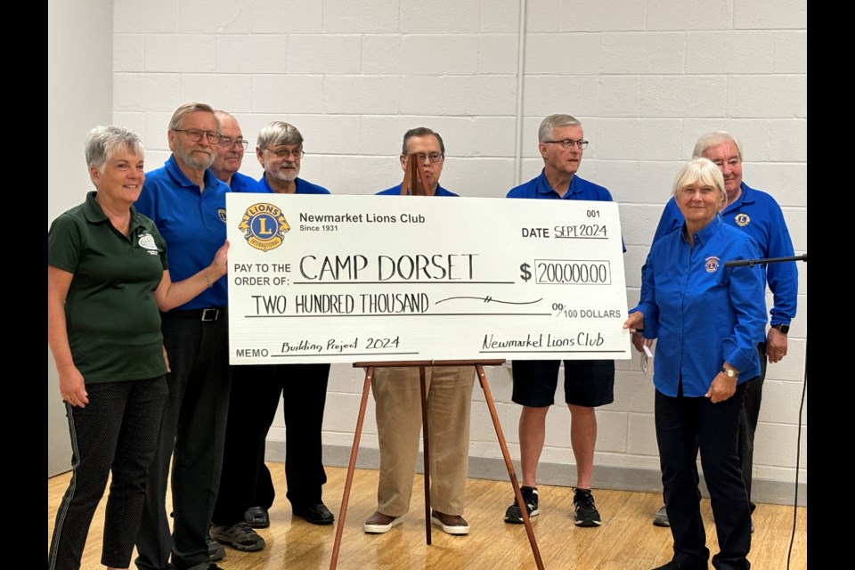 Members of the Newmarket Lions Club gather to present a cheque of $200,000 to Camp Dorset. 