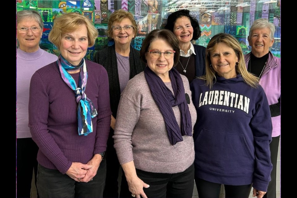 Board members of CFUW Aurora/Newmarket wear purple in honour of gender-based violence awareness.