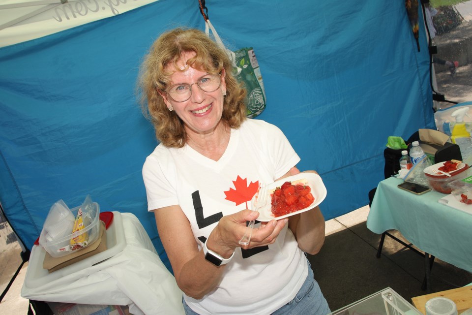 Barb Wilson of Sweet-alicious Cakery won in the professional category at the Newmarket Farmers' Market strawberry festival baking contest June 29. Afterwards, she sold slices of her award-winning strawberry pie.