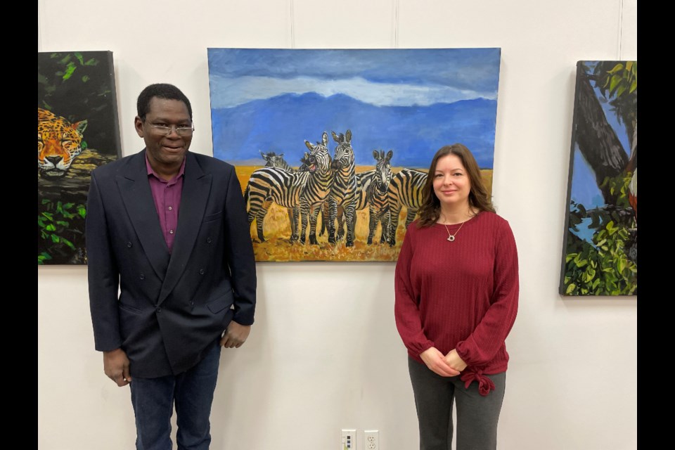 Newmarket artist Adubi “Dubi” Akinola and Royal Rose Art Gallery & Gifts owner Rosa Calabrese.